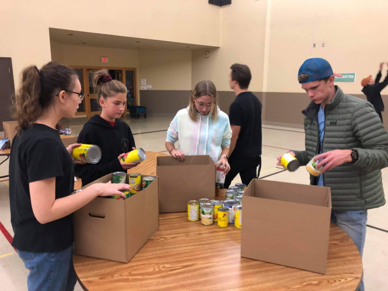Local youth canvasing Altona, Morden, and Winkler for Drive Away Hunger
