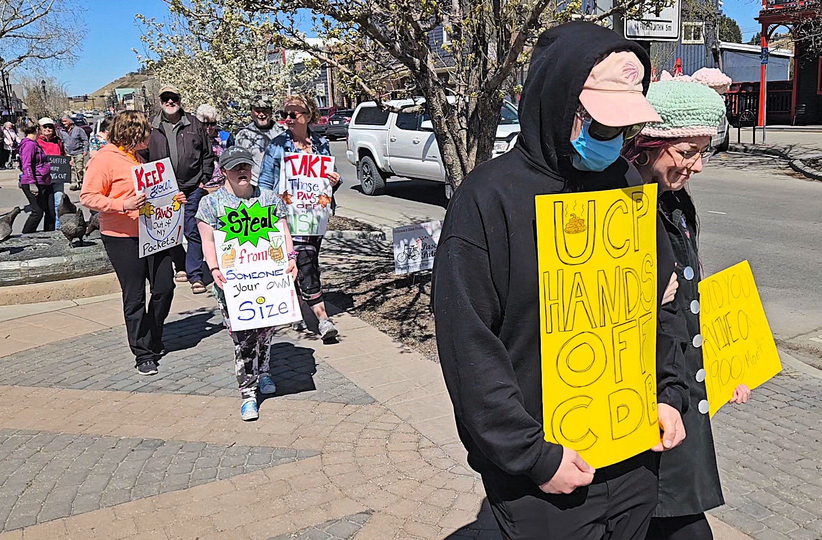 Protesters speak out against disability benefit clawback in Cochrane ...