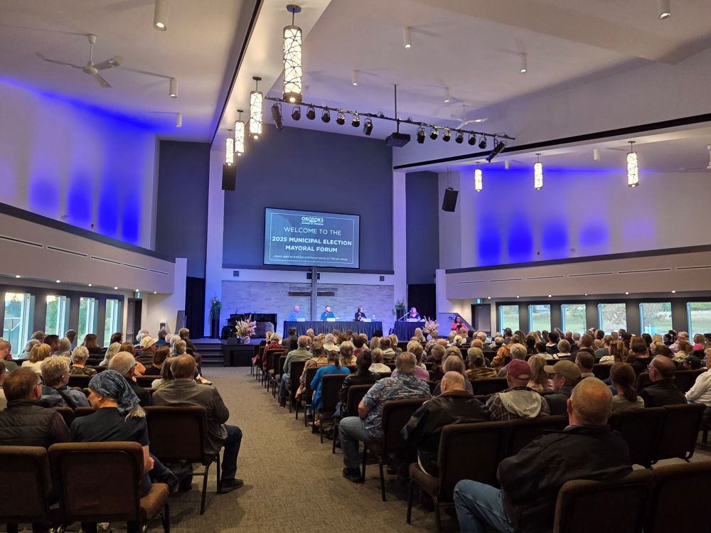 Okotoks mayoral candidates address community concerns at packed forum