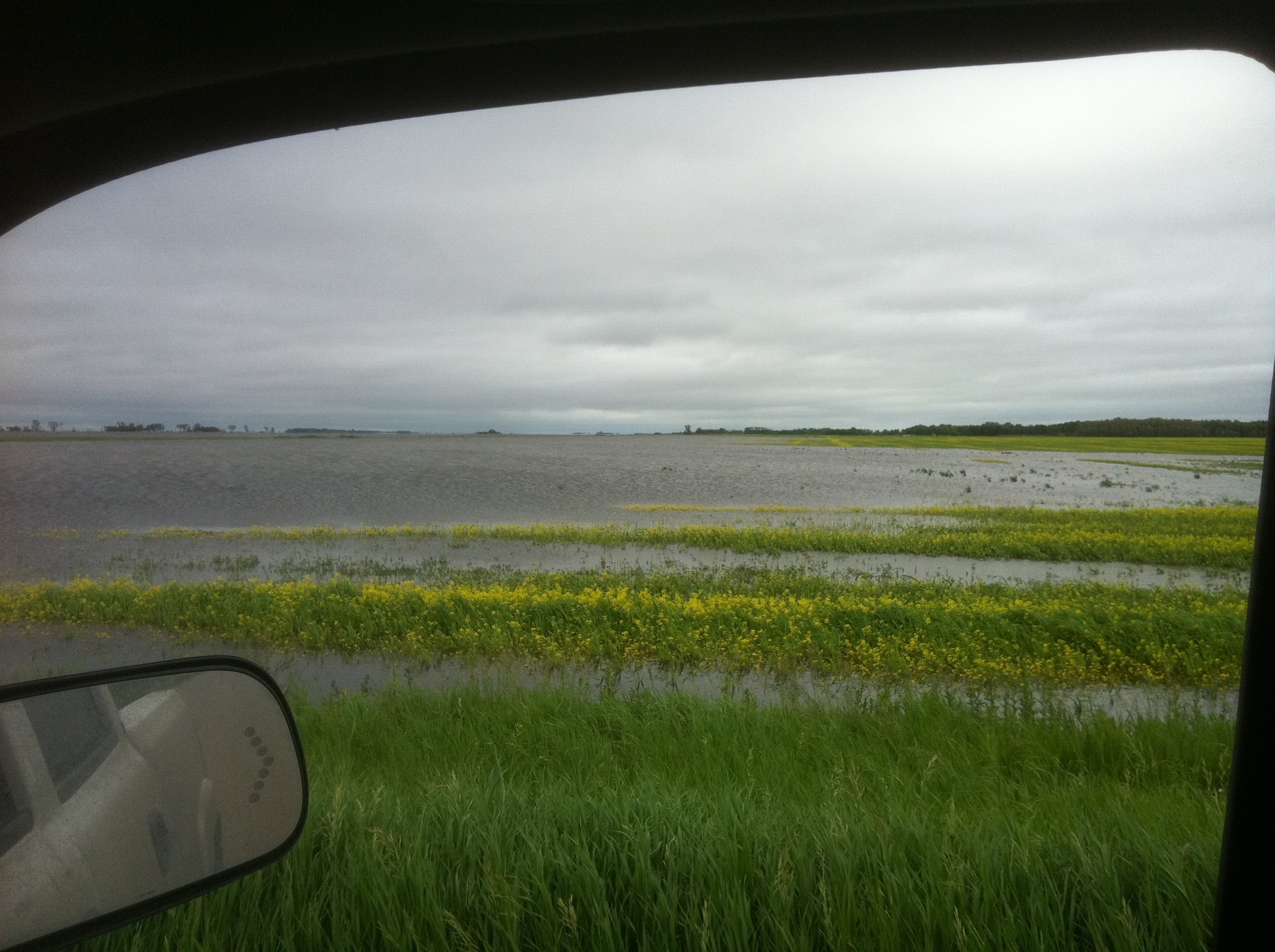 Lake Manitoba and east Portage Diversion drain flooding pressures farms near Portage