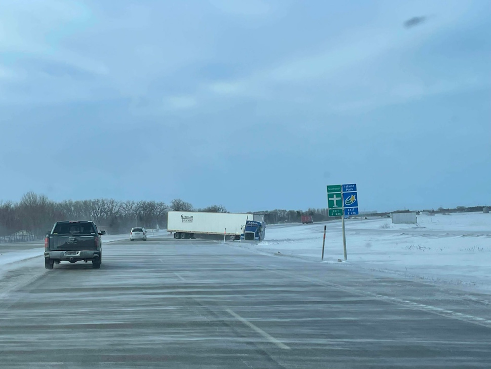 Transport truck blocks westbound lane on Trans-Canada Highway east of Portage