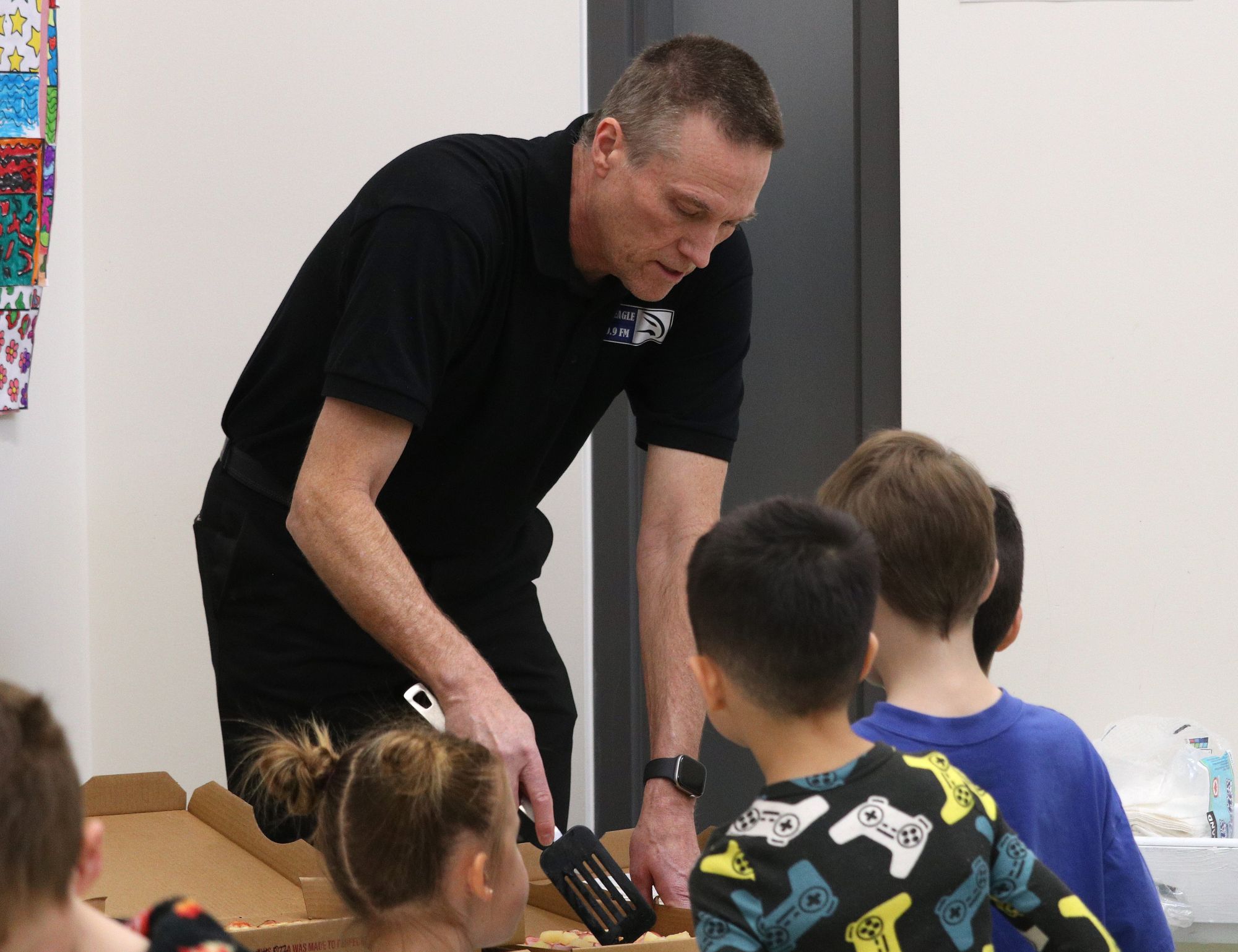 Ms. Austen's Grade 1 class celebrates Classroom of the Month with PJs and pizza